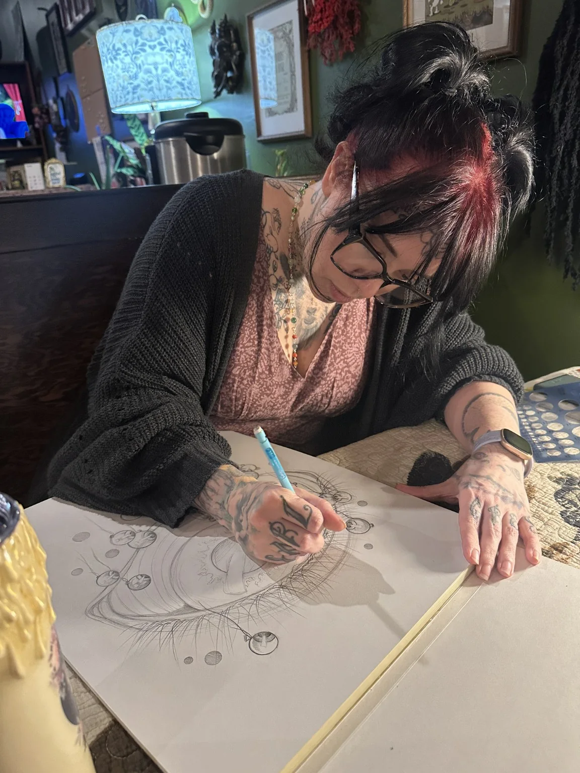 Tricky Lake drawing an original tattoo design