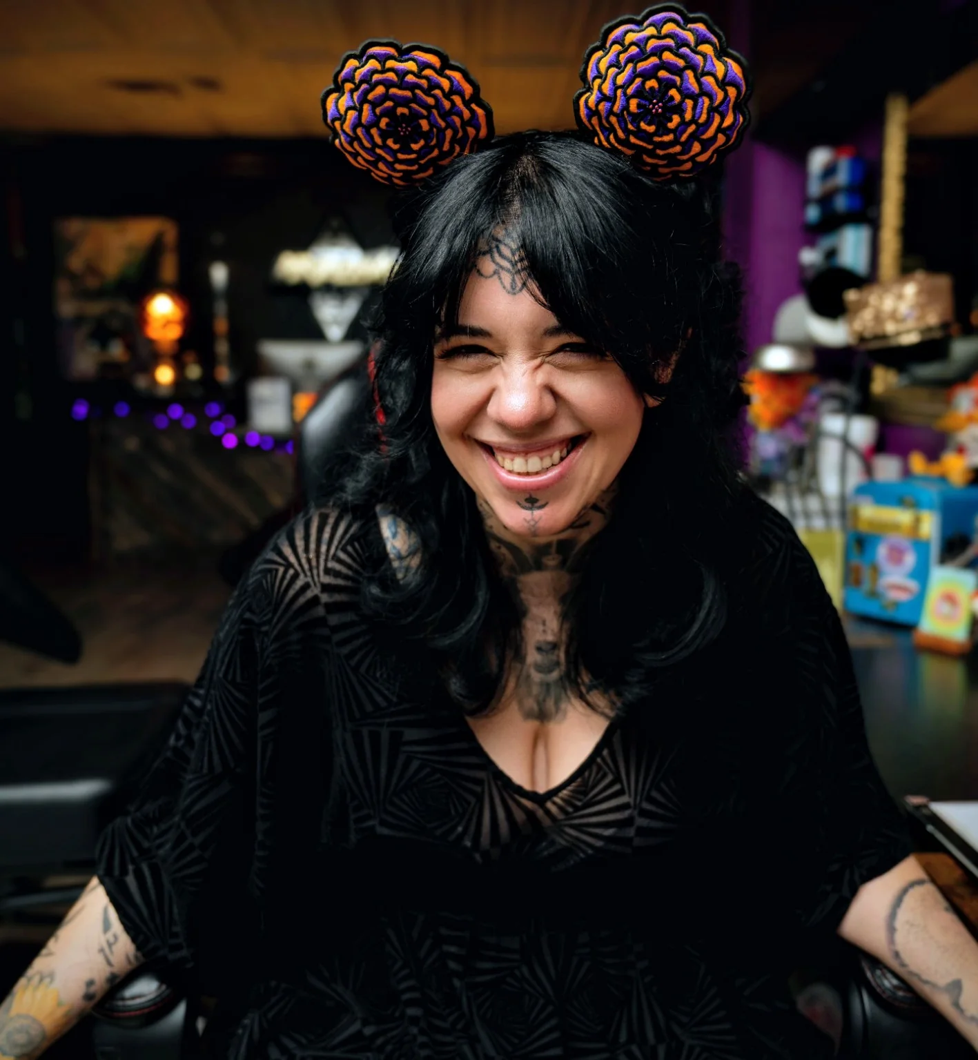 Tattoo artist Tricky Lake smiling in her studio